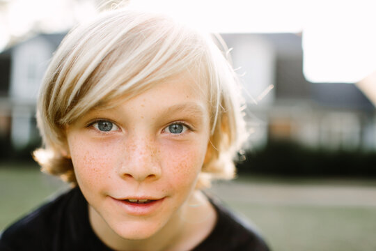 Up close portrait of a young, blonde boy