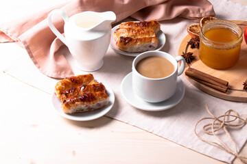 a ceramic cup of coffee and honey treats