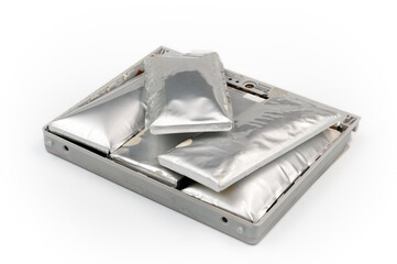 Broken lithium-ion swollen battery pack from laptop isolated on white background. Deep focus.