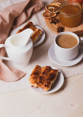 a ceramic cup of coffee and honey treats