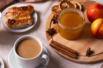 a ceramic cup of coffee and honey treats