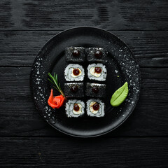 Set of sushi with eel fish and black sesame. Sushi menus. Top view. Free space for your text.