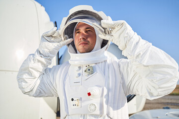 Close up shot of astronaut standing near shuttle