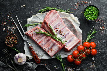 Raw pork ribs with spices. Meat. Top view. Free space for your text.