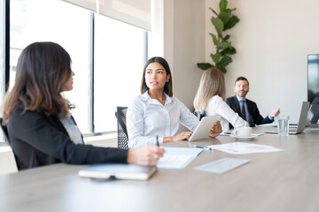 Businesspeople discussing working in meeting room
