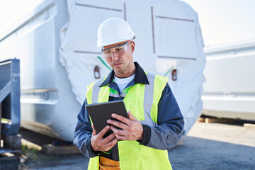 Fototapeta premium Portrait of engeenier in white hardhat