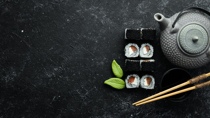 Sushi rolls -Fila Black with black caviar, salmon and cheese. Top view. Free space for your text.