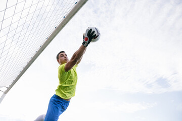 Goalie catching soccer ball
