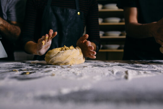 Baker making bread in bakery