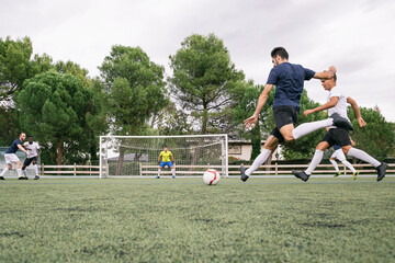 Soccer player kicking a ball during a soccer match