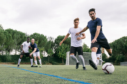 Fototapeta Men playing soccer