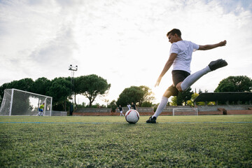 Football player kicking ball