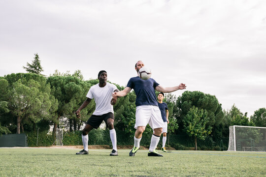 Men playing soccer