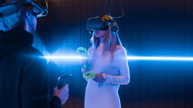 Friends enjoying vr gaming in an indoor arcade