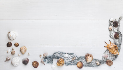 Fototapeta na wymiar Seashells and fishing net on white wooden background, banner for own text. Holiday and vacation concept.