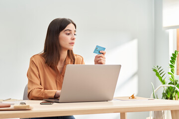 Young lady making online transaction