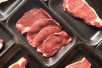 Raw meat in plastic packaging