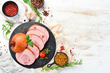 Boiled sausage with veal, spices and herbs. Top view. Free space for text.