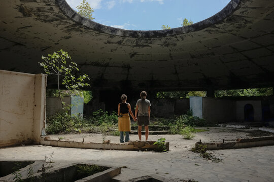Young couple in abandoned building