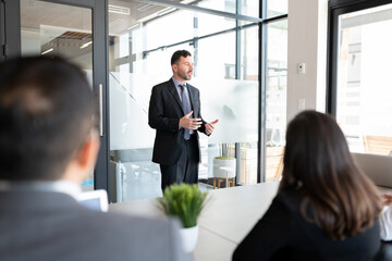 Businessman addressing his staff in a meeting room