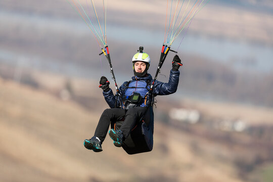 Portrait of a paraglider in the air