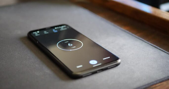 A smart phone user setting a 10 second timer on mobile application as a task reminder countdown.