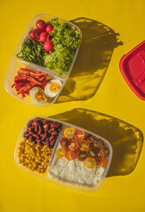 Homemade vegetarian food in lunch boxes with healthy vegetables. Vegetarian food concept. Healthy food. Top view, flat lay.