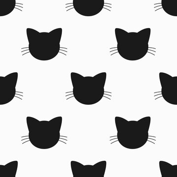 Black cats faces seamless pattern.