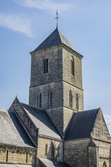 Fototapeta na wymiar Norman Romanesque style Church of Notre Dame (XII century) in Etretat. Etretat is a commune in Seine-Maritime department in Haute-Normandie region in France.