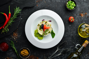 Risotto. Rice with vegetables in a plate. Top view. Free space for your text.