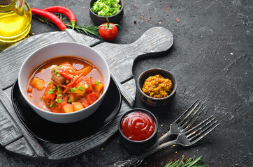 Veal Goulash. Vegetable soup with veal. Top view. Free space for your text.