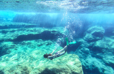 Girl diving in the Mediterranean sea