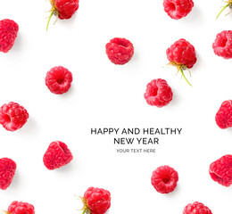 Creative happy and healthy new year card made of raspberries on the white background. Raspberries happy new year, festive greeting card.