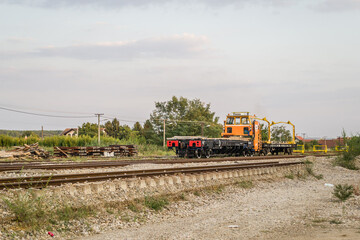 Fototapeta na wymiar Working machines for laying the railway in Petrovaradin near the city of Novi Sad, Serbia 