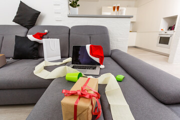 Messy living room interior with Christmas tree. Chaos after party