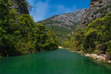 Fototapeta na wymiar View of turquoise lake in canyon Goynuk, located inside the Beydaglari Coastal National Park, Kemer district in Antalya Province, Turkey. August 2020