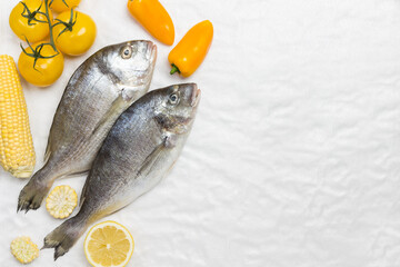 Raw fish with yellow vegetables.