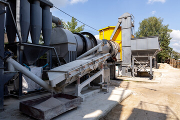Industrial production of construction mixtures. Tower silos with bulk ingredients. Line for drying and sorting of sand. © Sodel Vladyslav