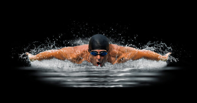 Man in swimming pool. Butterfly  style