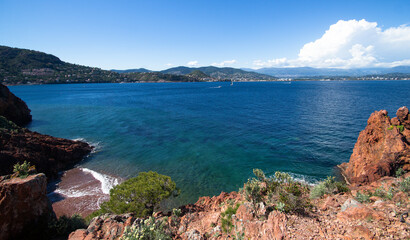 Fototapeta premium Blue mediterranean sea and red cliff during spring in Mandelieu, France