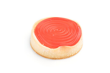 Single sweet tartlet with jelly and milk cream isolated on white background. Side view.