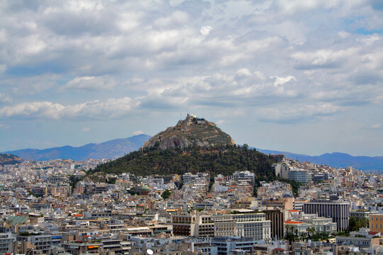 Athens aerial view over the city districts and Lykavitos hill,  Greece