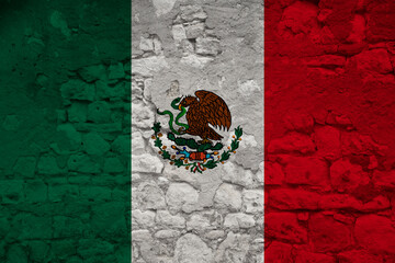 national flag of the state of mexico on an old stone wall with cracks, the concept of tourism, emigration, economy, politics, global world trade, civil rights, freedoms