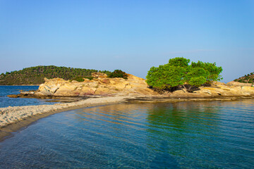 Obraz premium beautiful nature landscape summer photography of rocky island and lonely tree sea bay wilderness scenic view Greece Mediterranean region