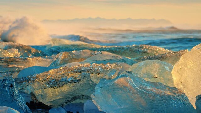 Close up, Okulsarlon Beach at sunset covered in ice