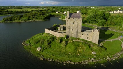 Pan right aerial, castle landmark in Ireland