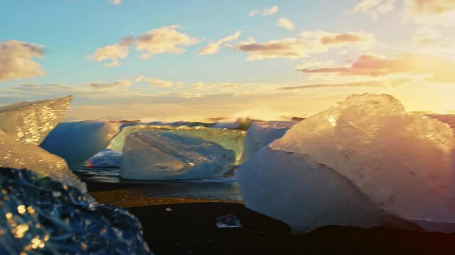 Close up, piece of ice on Okulsarlon Beach at sunset