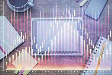 Double exposure of forex chart hologram over desktop with phone. Top view. Mobile trade platform concept.