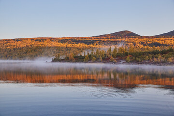 Autumn foggy frosty morning on the lake. Sunrise. Kolyma IMG4560