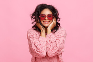 Happy ethnic woman in sunglasses laughing.